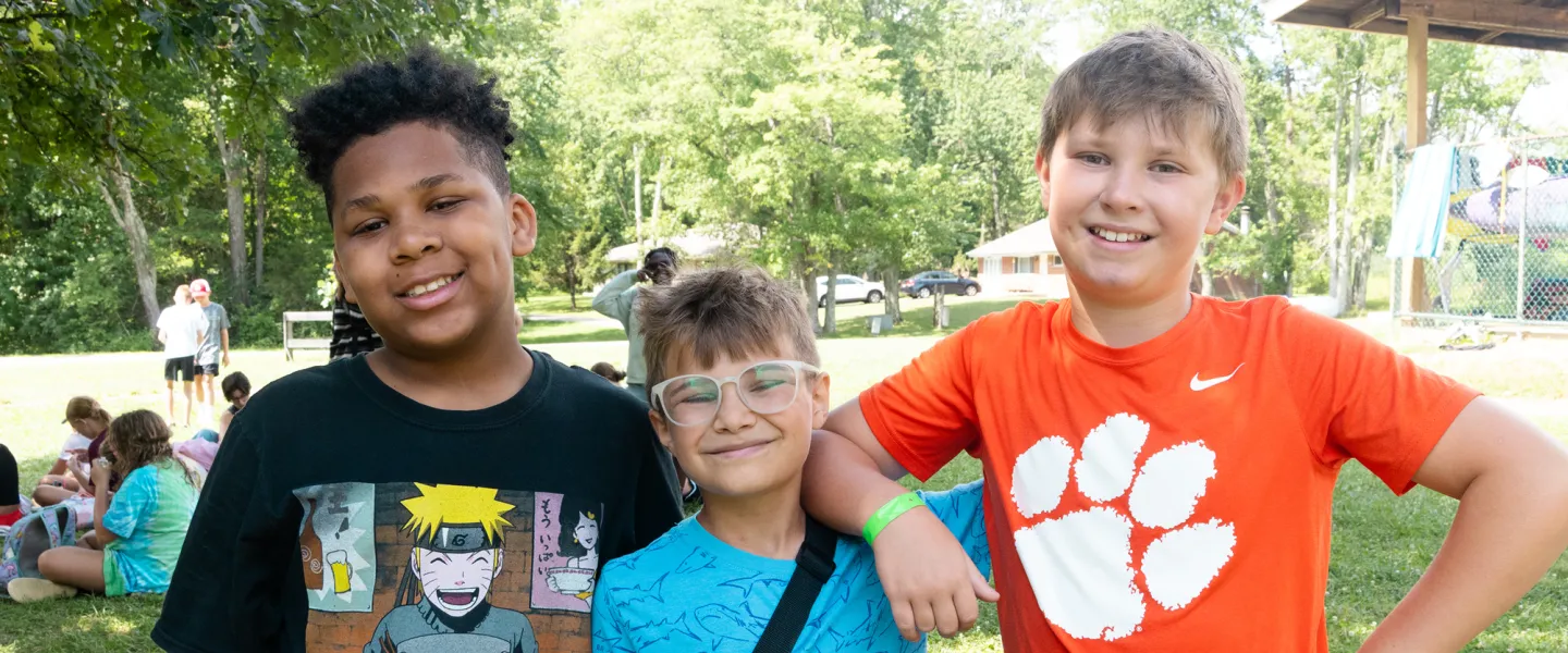 Friends taking a photo together at camp
