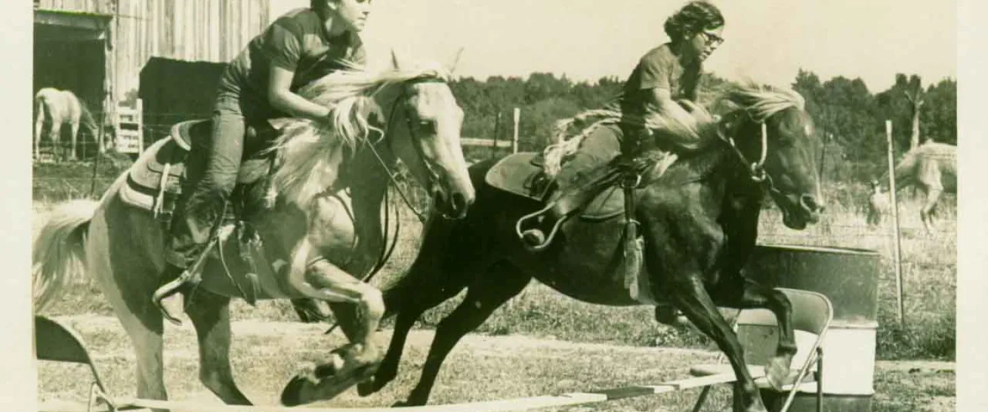 Old school photo of kids on horses at Camp Kern