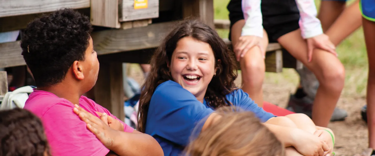 girl laughing with another kid