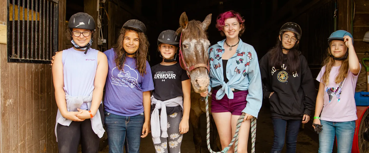 Girls with a horse at camp