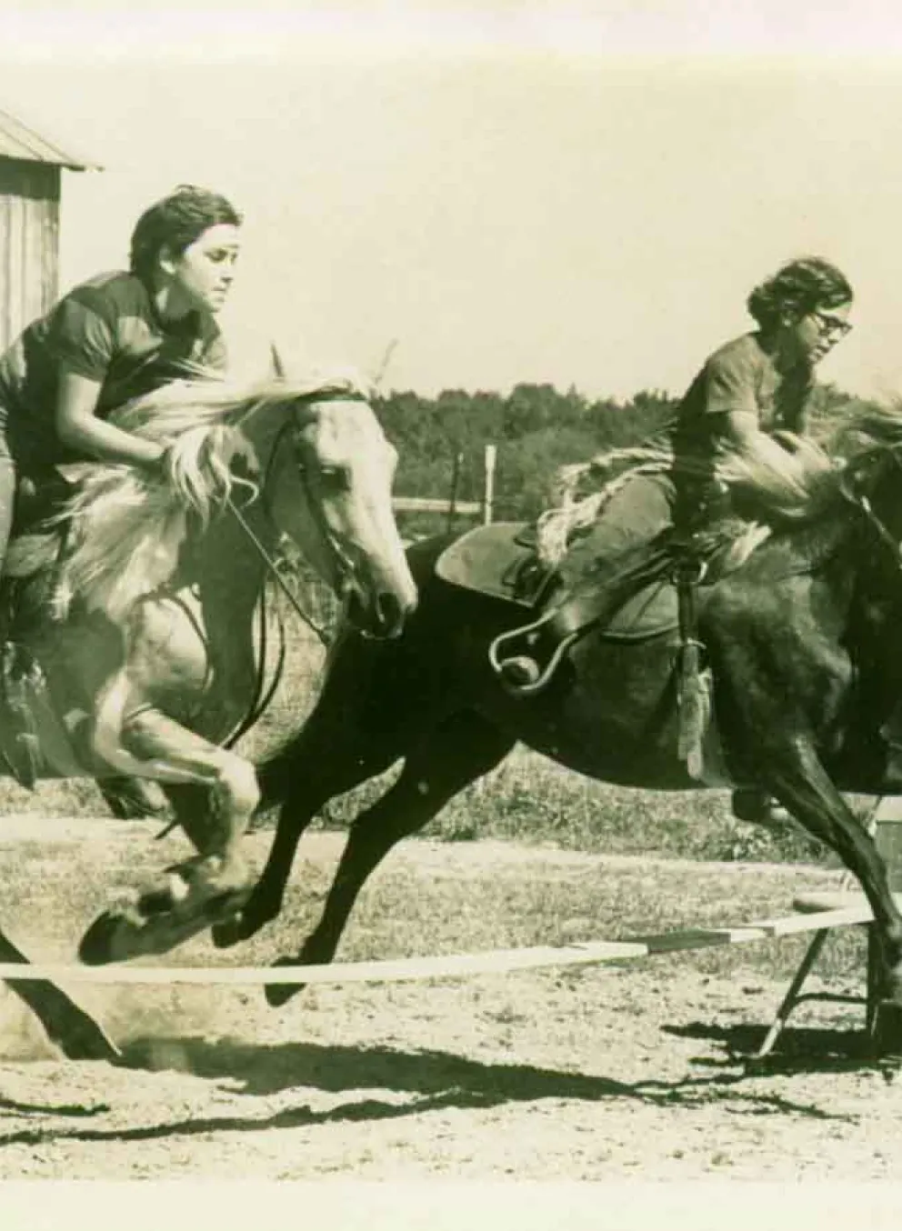 Old school photo of kids on horses at Camp Kern