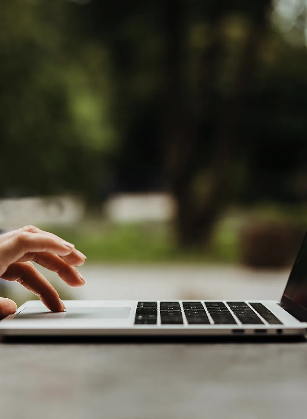 A person on a laptop outdoors