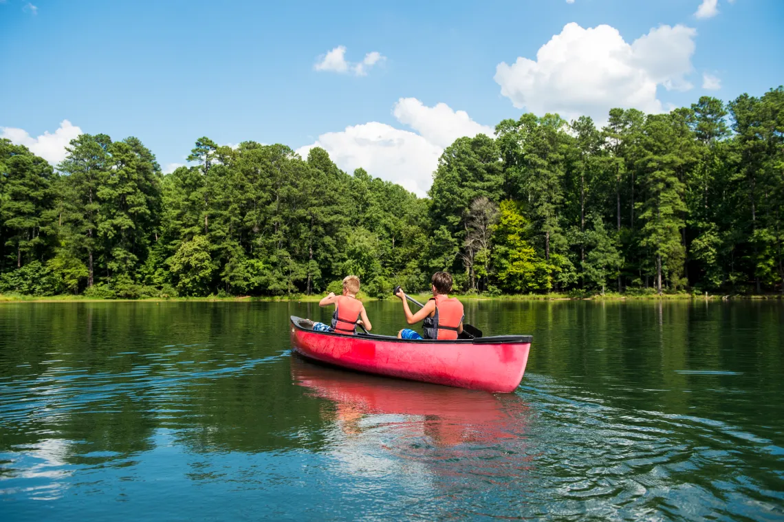 Kids in a canoe outdoors